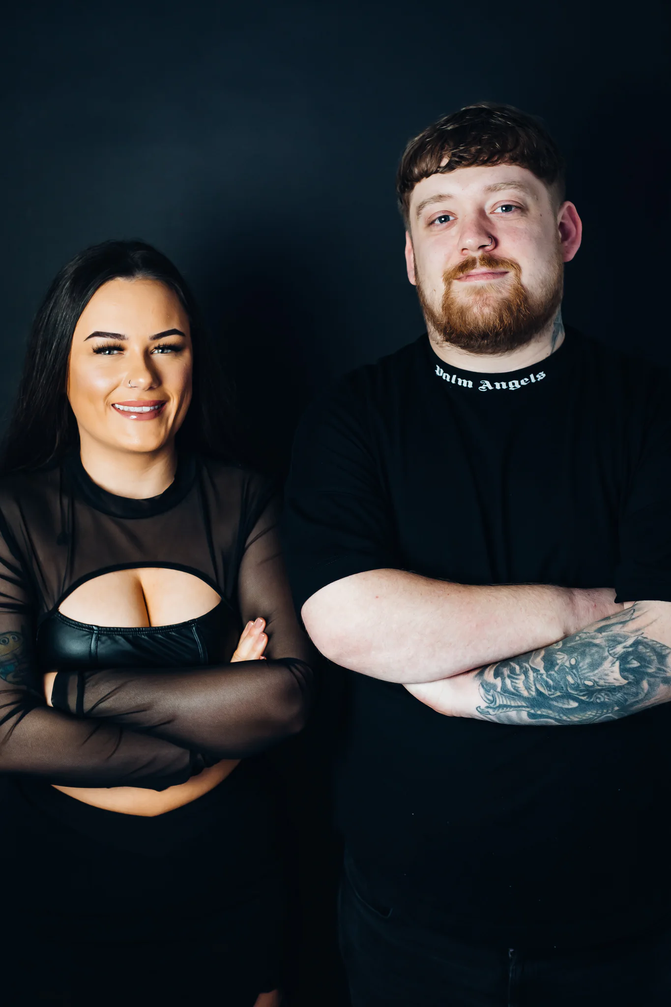 Jamie & Britney of Moodswing standing together in a studio portrait